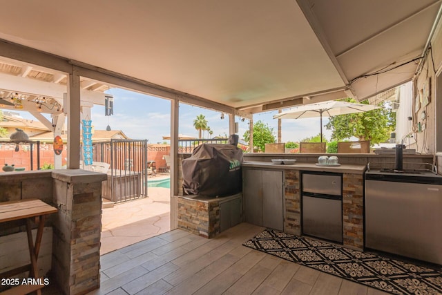 14001 N 34th Dr, Phoenix, AZ 85053 - fenced backyard with a bar, a patio, and a wooden deck