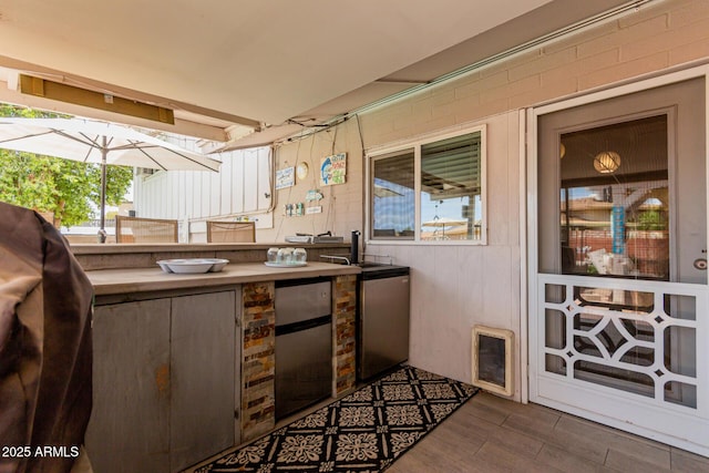 14001 N 34th Dr, Phoenix, AZ 85053 - view of patio / terrace with an outdoor bar and exterior kitchen