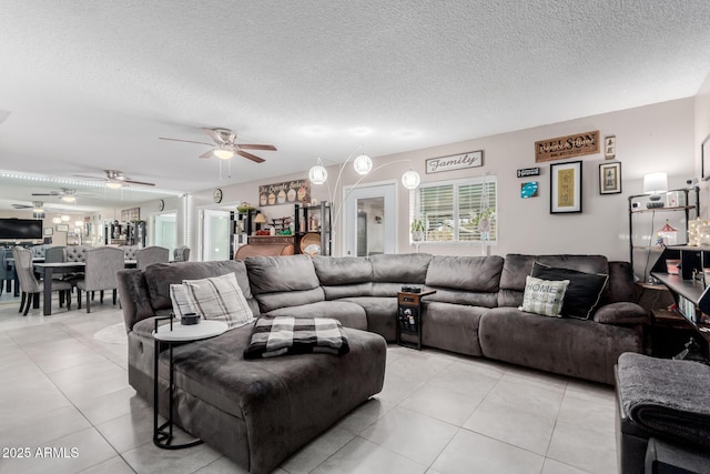 14001 N 34th Dr, Phoenix, AZ 85053 - living room with a textured ceiling, ceiling fan, and light tile patterned floors