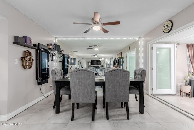 14001 N 34th Dr, Phoenix, AZ 85053 - dining area featuring ceiling fan, baseboards, and light tile patterned floors