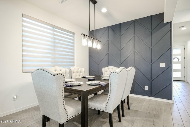 dining space featuring hardwood / wood-style flooring