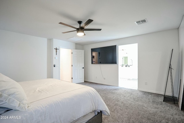 bedroom with carpet flooring, ceiling fan, and ensuite bathroom