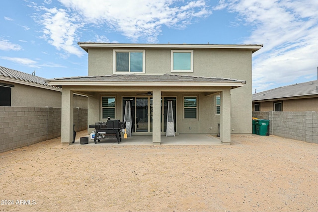 rear view of property with a patio area and outdoor lounge area