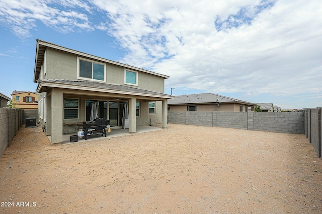 back of property featuring central AC and a patio area