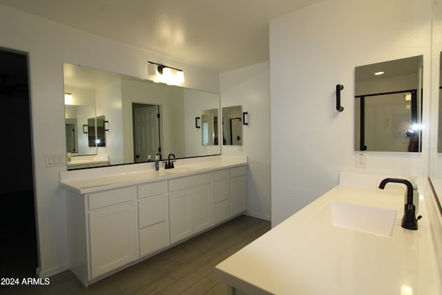 bathroom with wood-type flooring and vanity