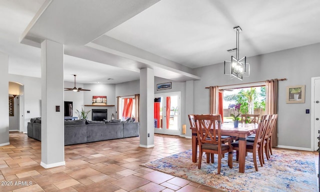 2699 E Claxton Rd, Gilbert, AZ 85297 - dining room with a ceiling fan and a glass covered fireplace