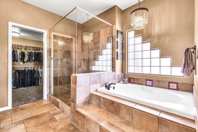 2699 E Claxton Rd, Gilbert, AZ 85297 - bathroom featuring a chandelier, a bath, a stall shower, and healthy amount of natural light