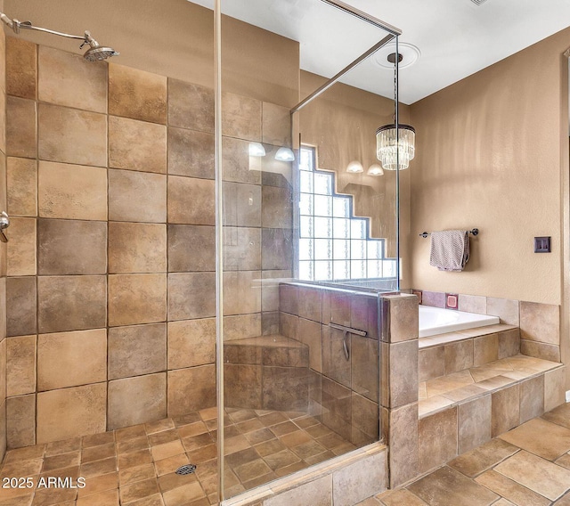 2699 E Claxton Rd, Gilbert, AZ 85297 - full bathroom featuring a tile shower, a garden tub, and a chandelier