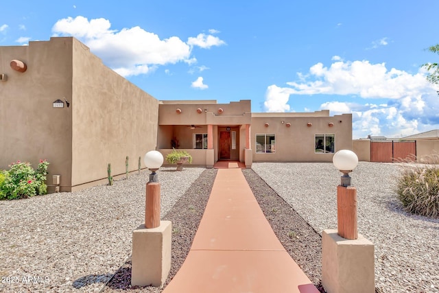 2699 E Claxton Rd, Gilbert, AZ 85297 - pueblo revival-style home with stucco siding and a ceiling fan