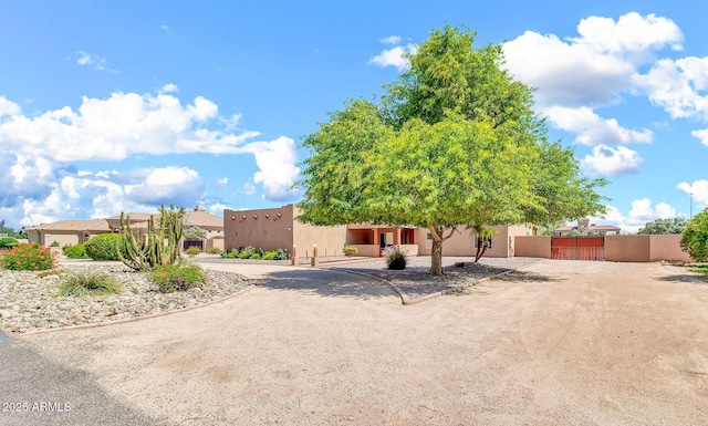 2699 E Claxton Rd, Gilbert, AZ 85297 - southwest-style home featuring stucco siding and a gate