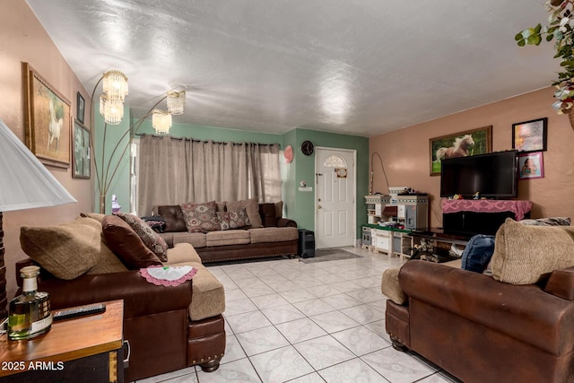 living room featuring light tile patterned floors and a chandelier