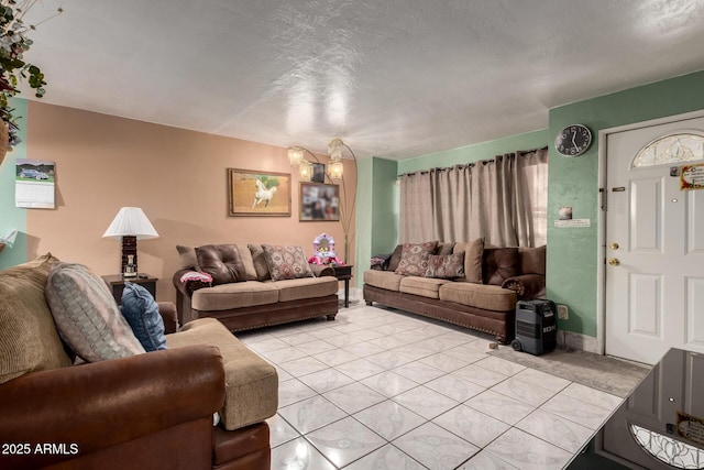 living area featuring light tile patterned flooring and baseboards