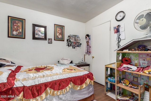 bedroom with wood finished floors