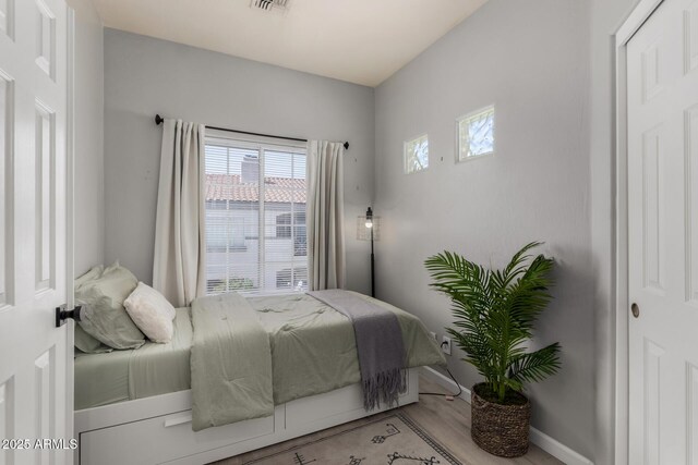 7936 E Wilshire Dr Unit 205, Scottsdale, AZ 85257 - bedroom with visible vents and baseboards