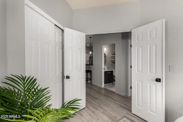 7936 E Wilshire Dr Unit 205, Scottsdale, AZ 85257 - corridor with light wood-style flooring and baseboards