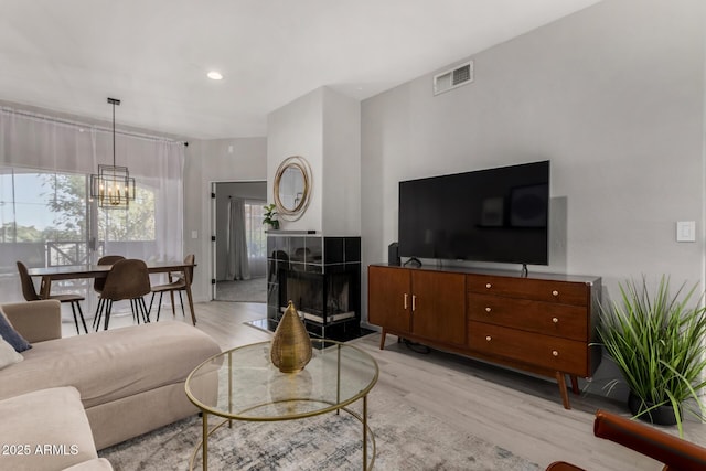 7936 E Wilshire Dr Unit 205, Scottsdale, AZ 85257 - living area with visible vents, light wood-style flooring, recessed lighting, and an inviting chandelier