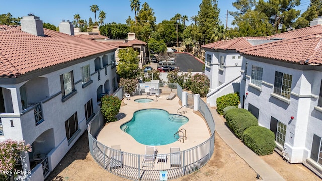 7936 E Wilshire Dr Unit 205, Scottsdale, AZ 85257 - pool with a patio area, a fenced backyard, and a community hot tub