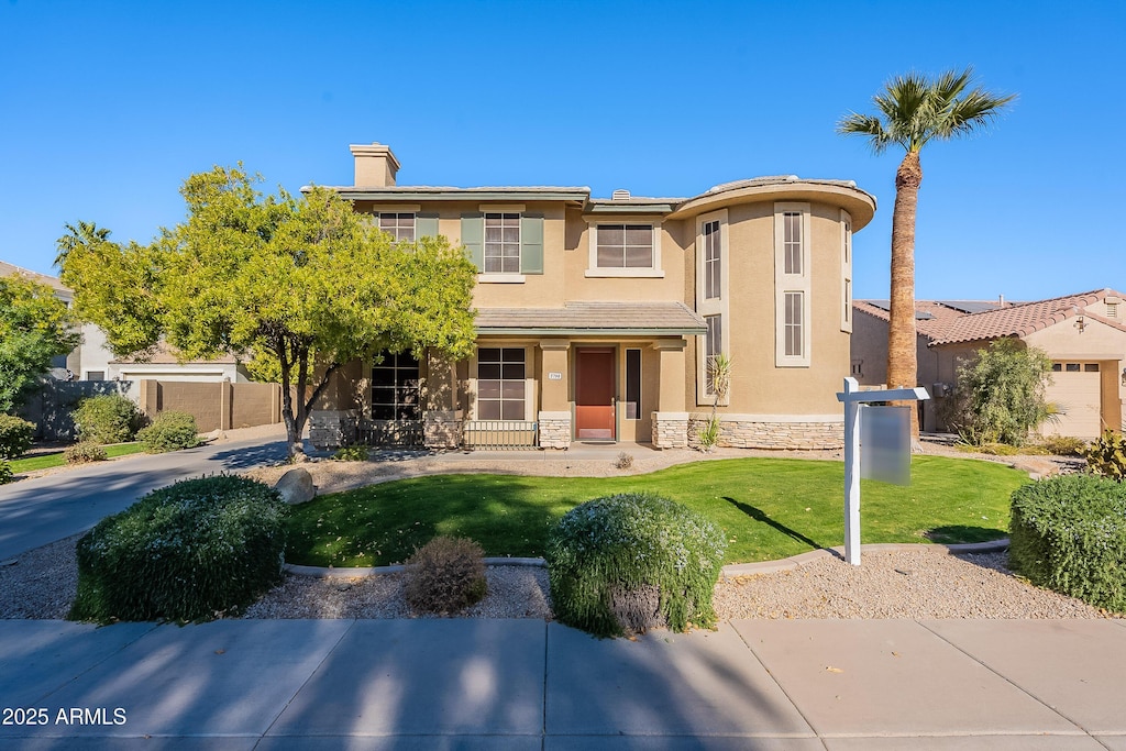 3798 E Latham Ct, Gilbert, AZ 85297 - view of front of house with a front lawn and a porch