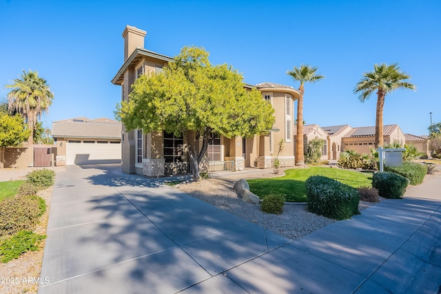 view of front of house featuring a front yard and a garage