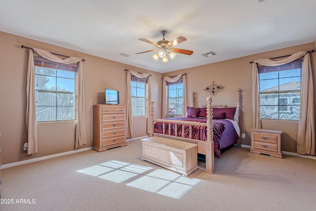 bedroom with ceiling fan and light colored carpet