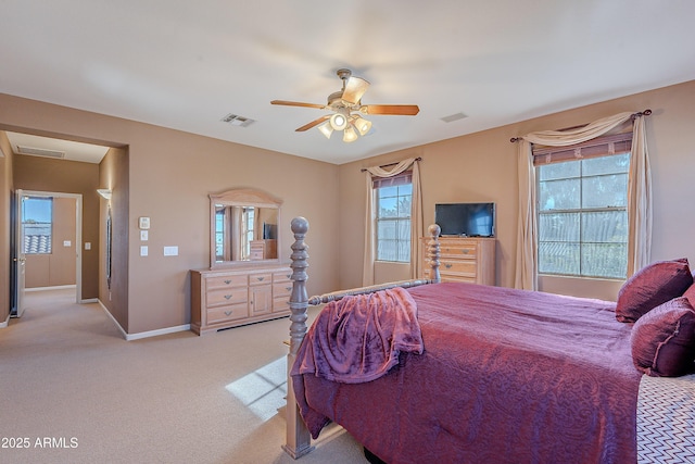 bedroom with ceiling fan and light colored carpet