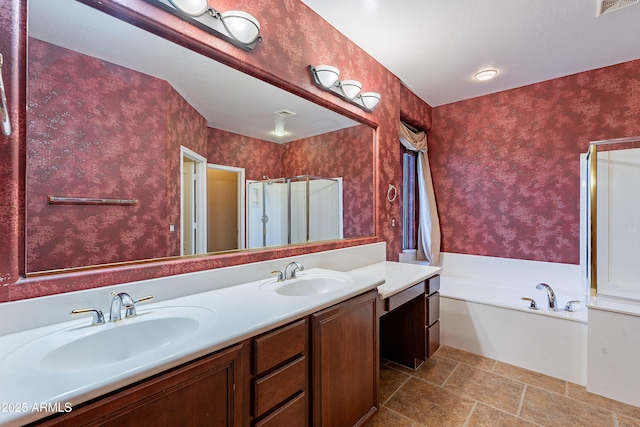 bathroom with vanity and independent shower and bath