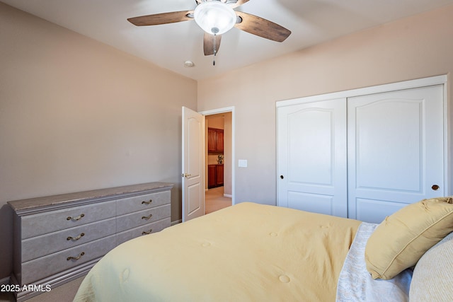 bedroom featuring ceiling fan and a closet