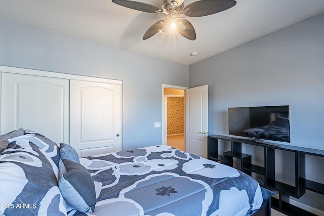 bedroom featuring ceiling fan and a closet