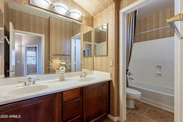 full bathroom featuring vanity, toilet, and shower / bath combo with shower curtain