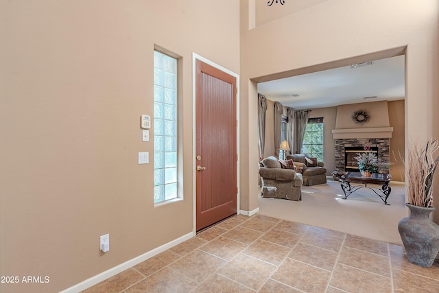 entrance foyer featuring a fireplace