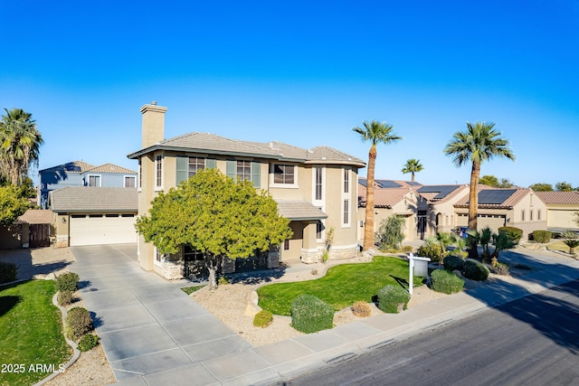 view of front facade featuring a front yard, solar panels, and a garage