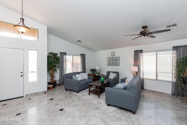 living room featuring lofted ceiling, baseboards, visible vents, and ceiling fan