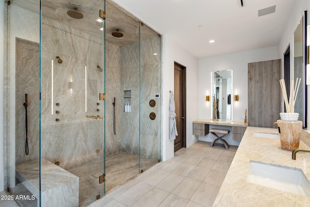 bathroom with vanity, tile patterned flooring, and a shower with shower door