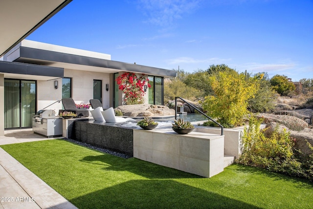 exterior space with an outdoor kitchen