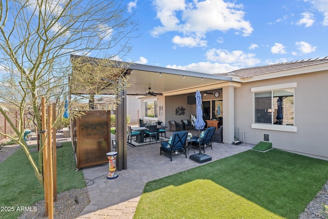 exterior space featuring a yard, outdoor lounge area, a patio, and ceiling fan