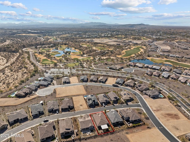 drone / aerial view featuring a water and mountain view