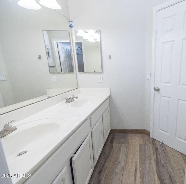 bathroom featuring hardwood / wood-style flooring and vanity