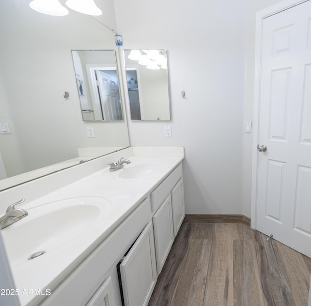 bathroom with vanity and hardwood / wood-style floors