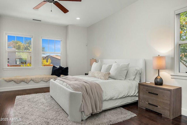 bedroom with dark wood-style floors, baseboards, visible vents, and recessed lighting