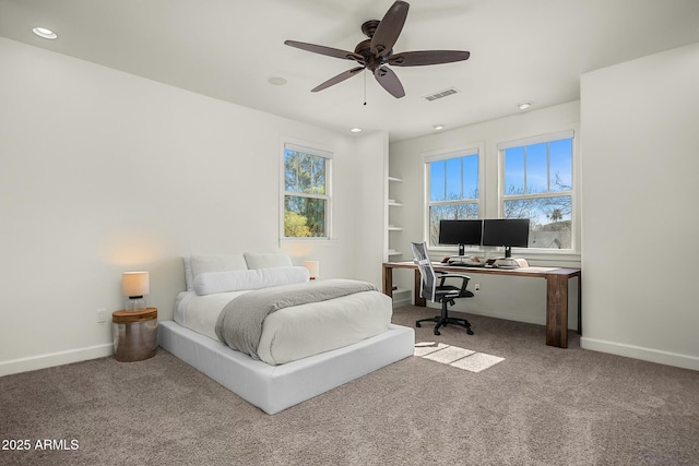 carpeted bedroom featuring a ceiling fan, recessed lighting, visible vents, and baseboards