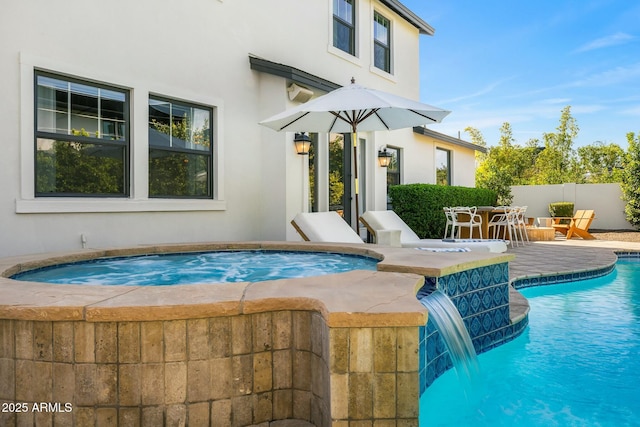 view of swimming pool featuring a fenced in pool, outdoor dining area, fence, and an in ground hot tub