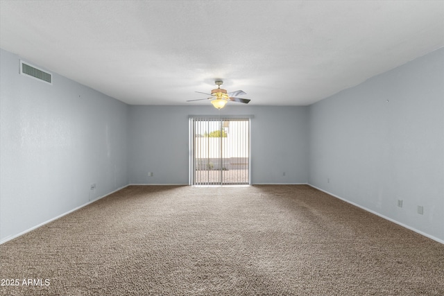 carpeted spare room with ceiling fan