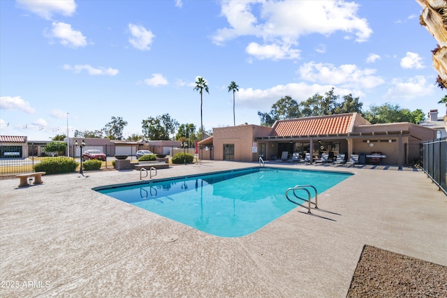 view of swimming pool featuring a patio area