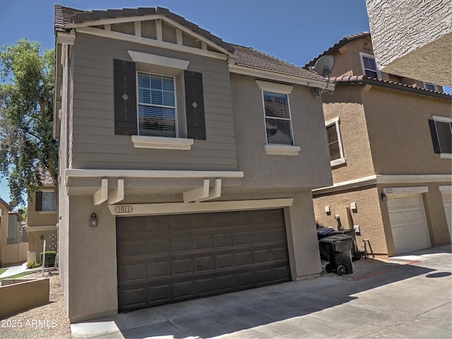 9233 E Neville Ave Unit 1011, Mesa, AZ 85209 - view of front of house featuring an attached garage, a tile roof, and stucco siding