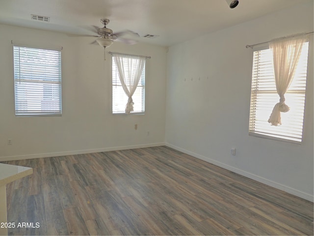 9233 E Neville Ave Unit 1011, Mesa, AZ 85209 - unfurnished room with dark wood-type flooring and a ceiling fan