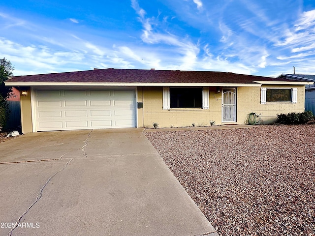 single story home with a garage