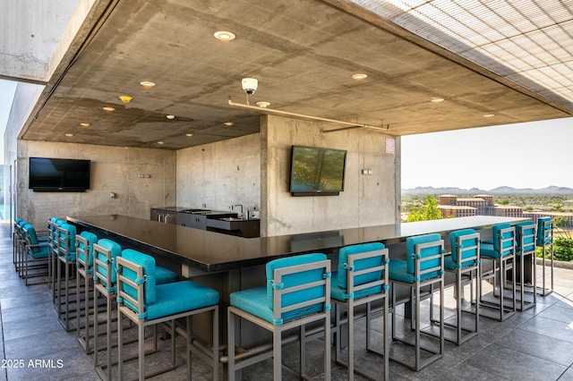 view of patio with an outdoor bar