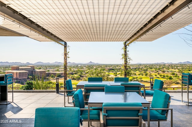 view of patio with a mountain view and a pergola