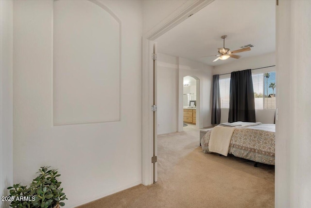 bedroom featuring ceiling fan and light colored carpet