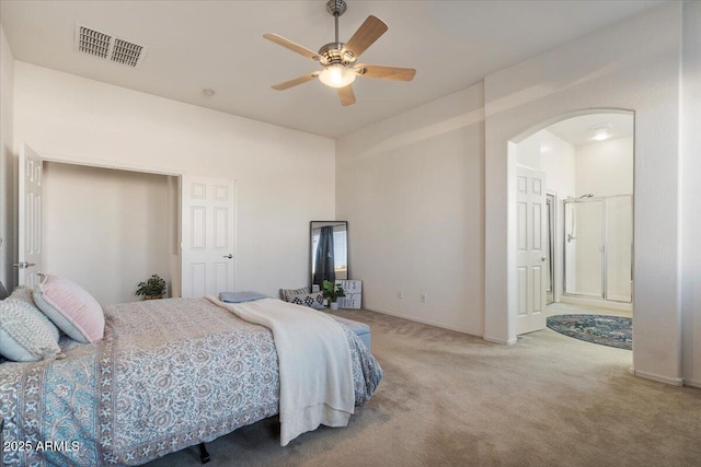 bedroom featuring ceiling fan, carpet floors, and connected bathroom